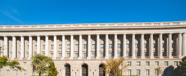 Classical style architecture with repeating design features in banner image. Classical style architecture with repeating design features of columns and windows in banner image. IRS Headquarters Building stock pictures, royalty-free photos & images