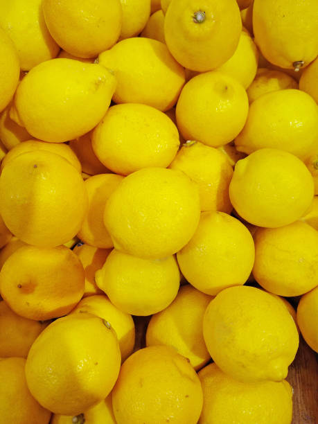 istock a bunch of yellow ripe lemons 1253302519