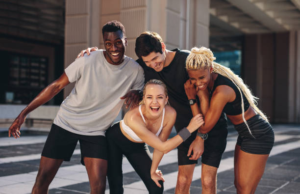 istock Group of runners having fun after outdoor training 1253304414