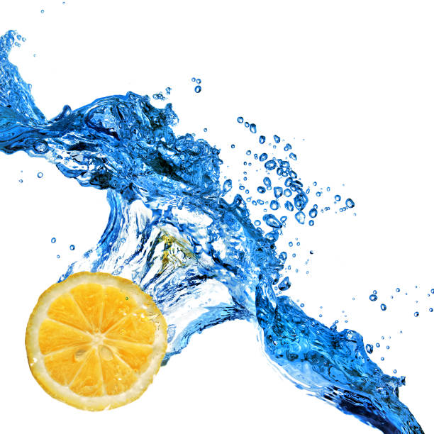 istock orange dropped in to water with splash isolated on white 1253304650