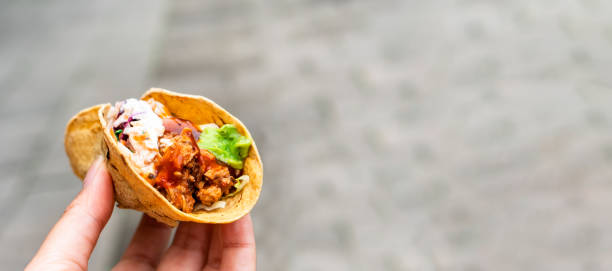 istock Mexican traditional authentic homemade tacos with pulled pork beef chili con carne serve with tomato salad and avocado guacamole and dip sauce 1253305130