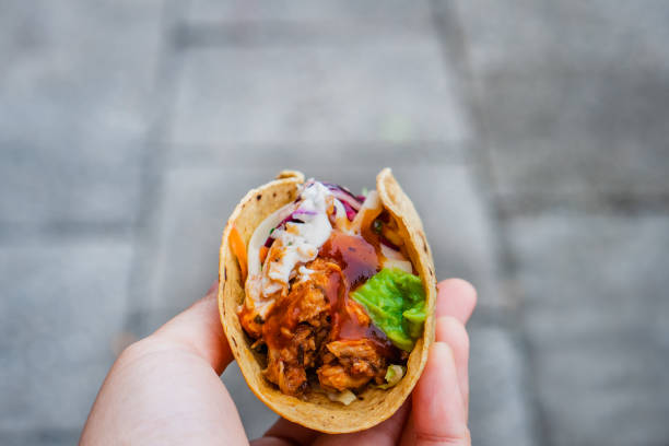 istock Mexican traditional authentic homemade tacos with pulled pork beef chili con carne serve with tomato salad and avocado guacamole and dip sauce 1253305165