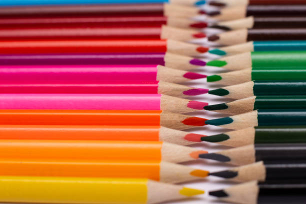 istock Multi-colored pencils on a white background dense arrangement to each other 1253308475