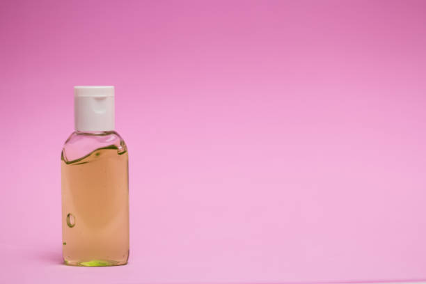istock antiseptics bottle on a pink background 1253309001