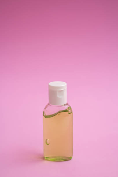 istock antiseptics bottle on a pink background 1253309005
