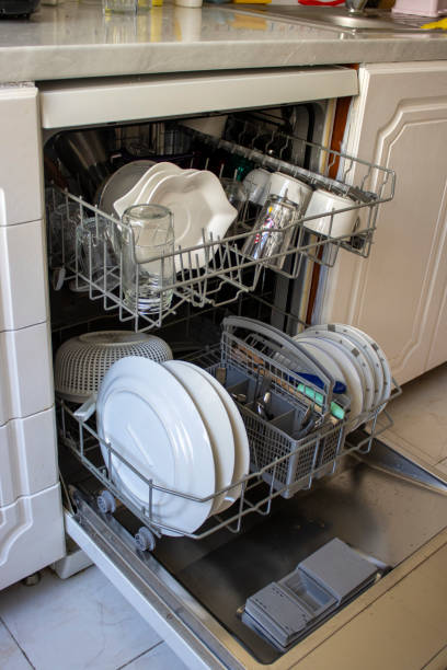 istock Open Dishwasher With Dirty Dishes 1253310491
