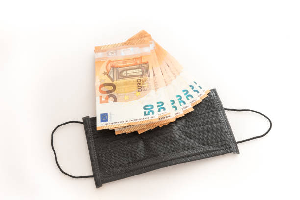 istock Covid-19 masks and money 1253312894
