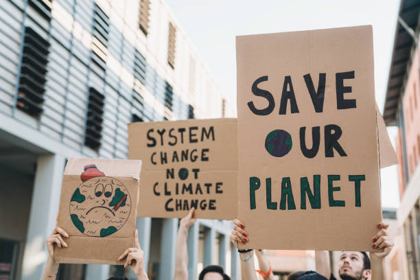 istock Group of people participating in a protest against global warming 1253315285