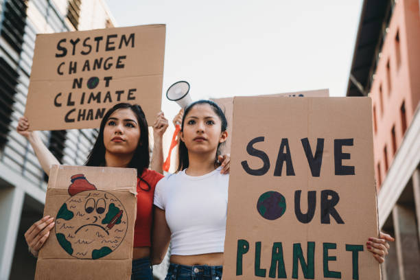 istock Group of people participating in a protest against global warming 1253315330