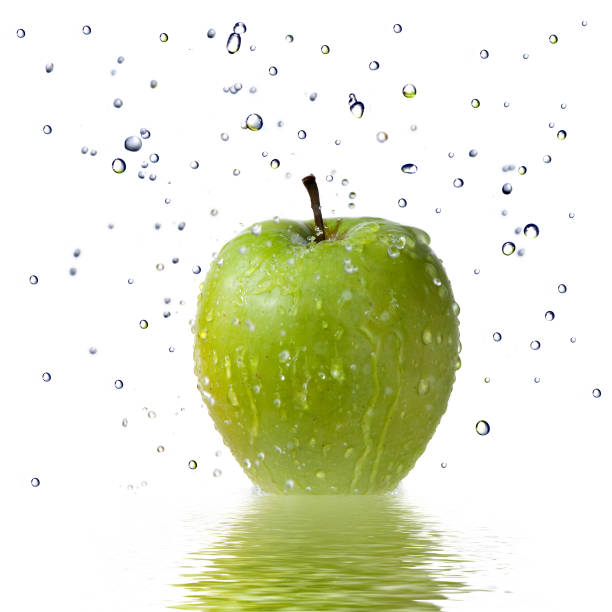 istock fresh water drops on green apple isolated on white 1253316750