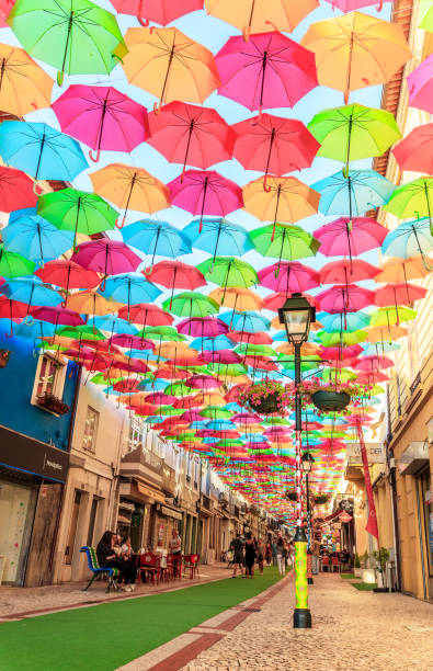 Street full of colorful umbrellas in Agueda, Portugal. stock photo