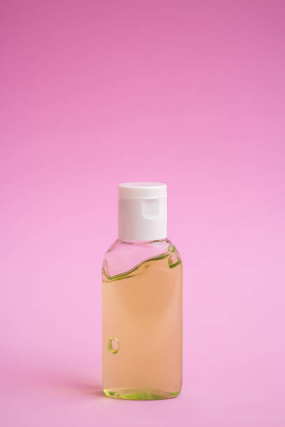istock antiseptics bottle on a pink background 1253318312