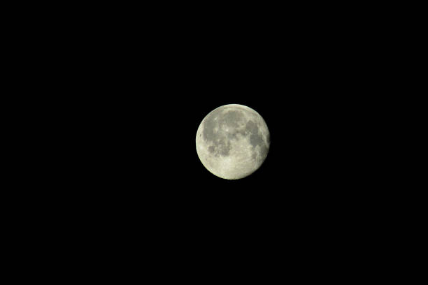 The moon in the dark sky close plan