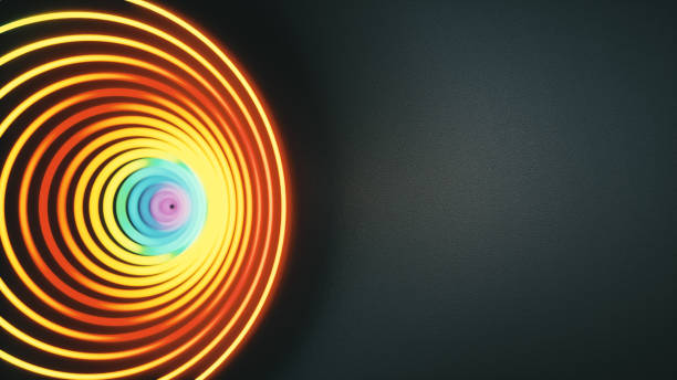 istock Bright glowing rainbow multicolored spiral cyclone design on a dark background with copy space 1253320026