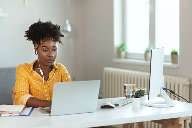 istock Businesswoman Using a Laptop to Make a Conference Call 1253320317