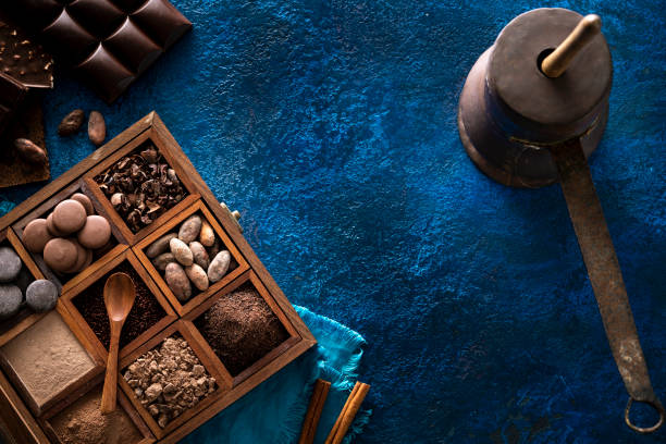 Chocolate pot copper box with cocoa beans, chololate drops cocoa powder and chocolate beans