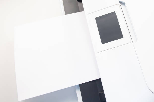 istock Home print. Printer and a sheet of white paper 1253326614