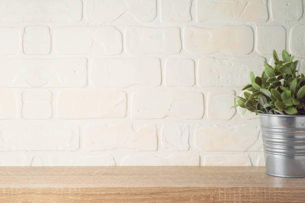 istock Empty wooden shelf with plant over brick wall interior. Kitchen mock up for design 1253329561