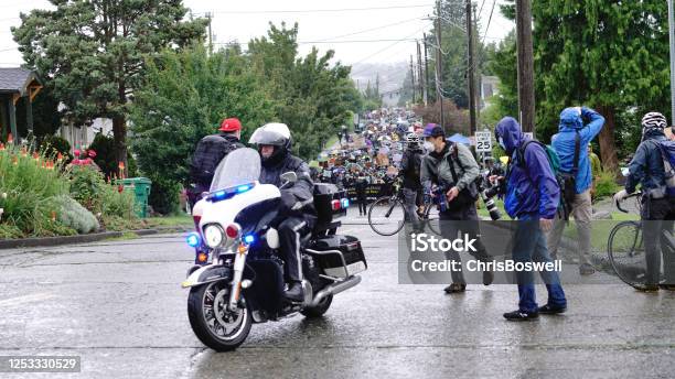 Silent Protesters March In The Rain Through Neighborhoods In Seattle Calling Attention To The Black Lives Matter Movement And Police Brutality Stock Photo - Download Image Now
