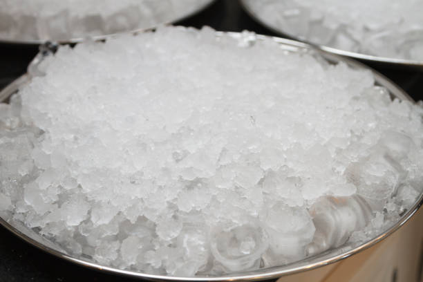 Crushed ice in a metal bowl.
