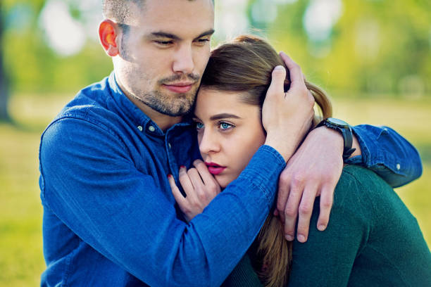 istock Young man is consoling his girlfriend 1253337743