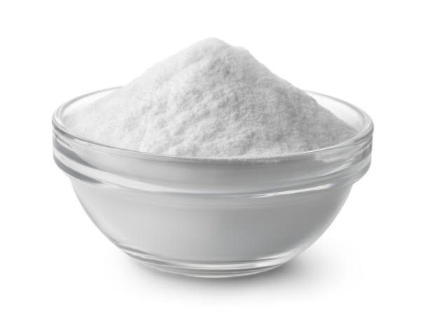 Glass bowl of baking soda Glass bowl of baking soda isolated on white powdered sugar stock pictures, royalty-free photos & images