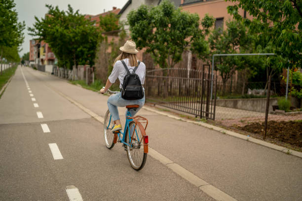istock Young beautiful woman on a vintage bicycle. 1253340075