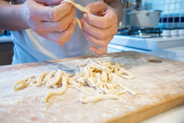 istock Homemade noodle cutting 1253340469