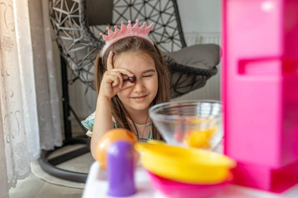 istock Little girl with pink crown 1253341318