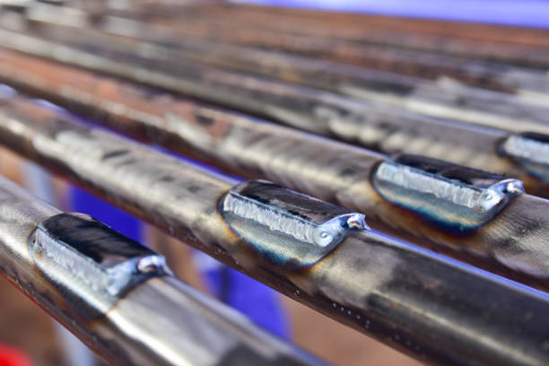 Closeup the connection between the plate and the pipe welding by Tungsten Inert Gas Welding process (TIG).