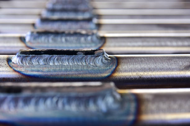 Closeup the connection between the plate and the pipe welding by Tungsten Inert Gas Welding process (TIG).