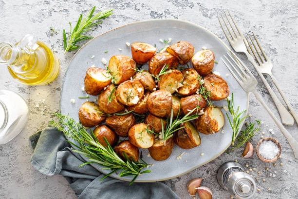 istock Baked potatoes with rosemary, thyme and garlic 1253342587