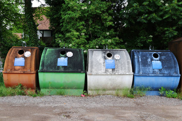 Colourful old waste containers for different coloured glass and tin cans