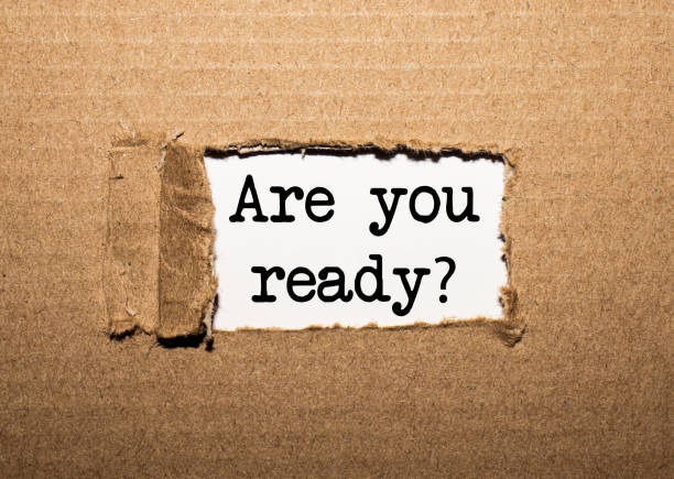 istock The text ARE YOU READY. behind torn brown paper 1253342863