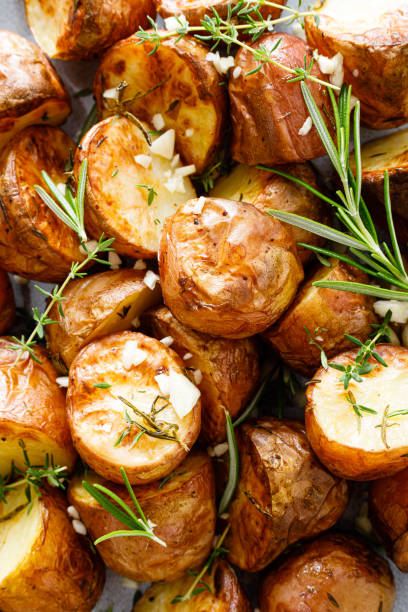 istock Baked potatoes with rosemary, thyme and garlic 1253342904