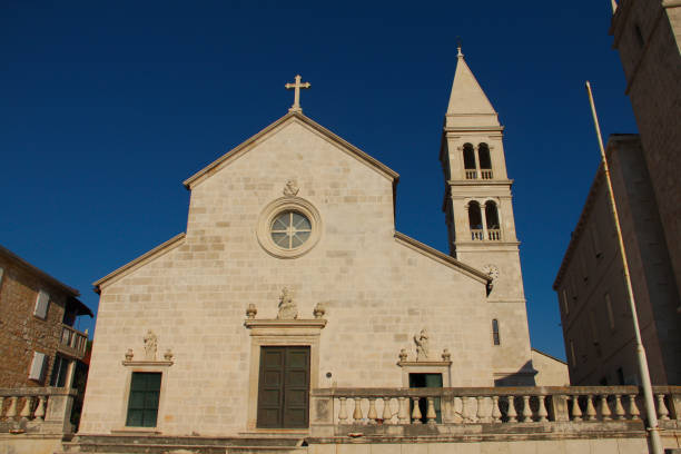 Church of Saint Peter in Supetar Church of Saint Peter in Supetar, Croatia, front view old catholic church on island brac croatia stock pictures, royalty-free photos & images