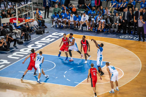 istock Basketball player taking penalty shot 1253346025