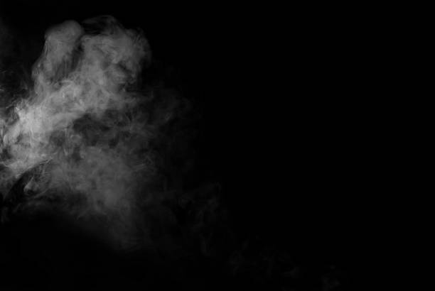 istock White smoke on a black background. The texture of scattered smoke. Blank for design. Layout for collages. 1253346366