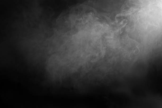 istock White smoke on a black background. The texture of scattered smoke. Blank for design. Layout for collages. 1253346367