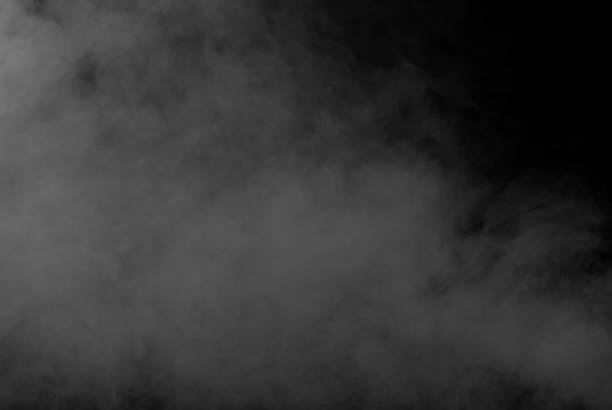istock White smoke on a black background. The texture of scattered smoke. Blank for design. Layout for collages. 1253346368
