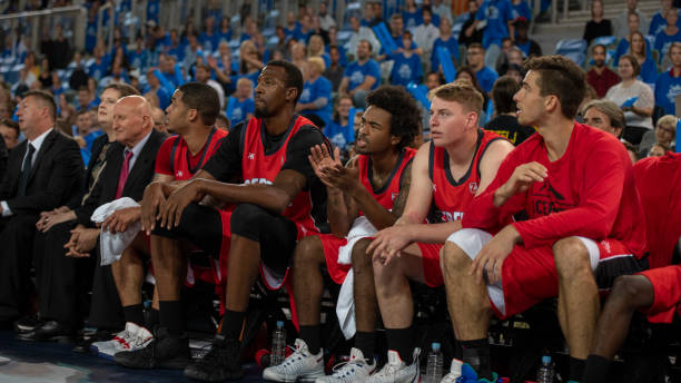 istock Basketball players watching match 1253347038