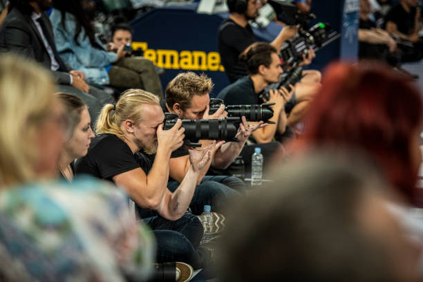 Media photographing during basketball match