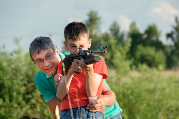 istock Father and Son Rifle Lessons 1253348039