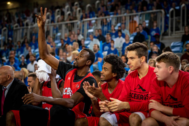 istock Basketball players watching match 1253348081