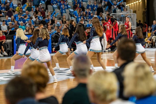 istock Cheerleaders performing on court 1253348188