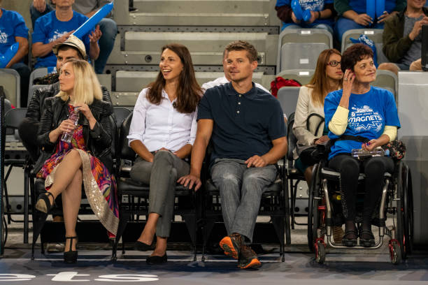 istock Celebrities watching basketball match 1253348383