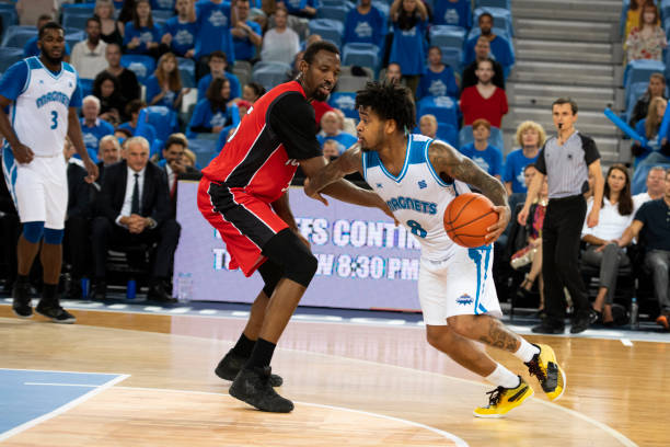 istock Basketball players chasing for ball 1253349420