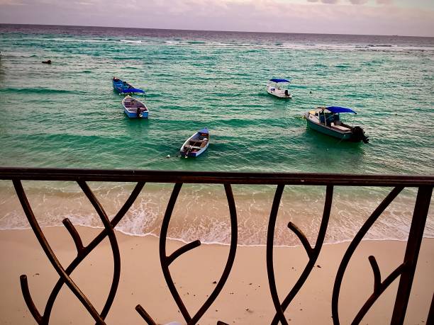 Five Tiny Boats in The Caribbean Sea