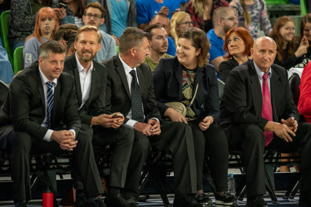 istock Celebrities and coach watching basketball match 1253350096