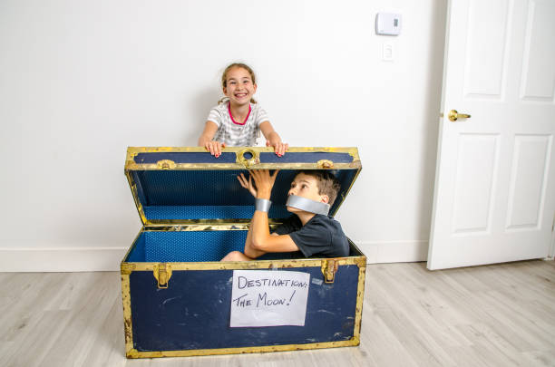 istock Girl expediting brother on the Moon 1253350307